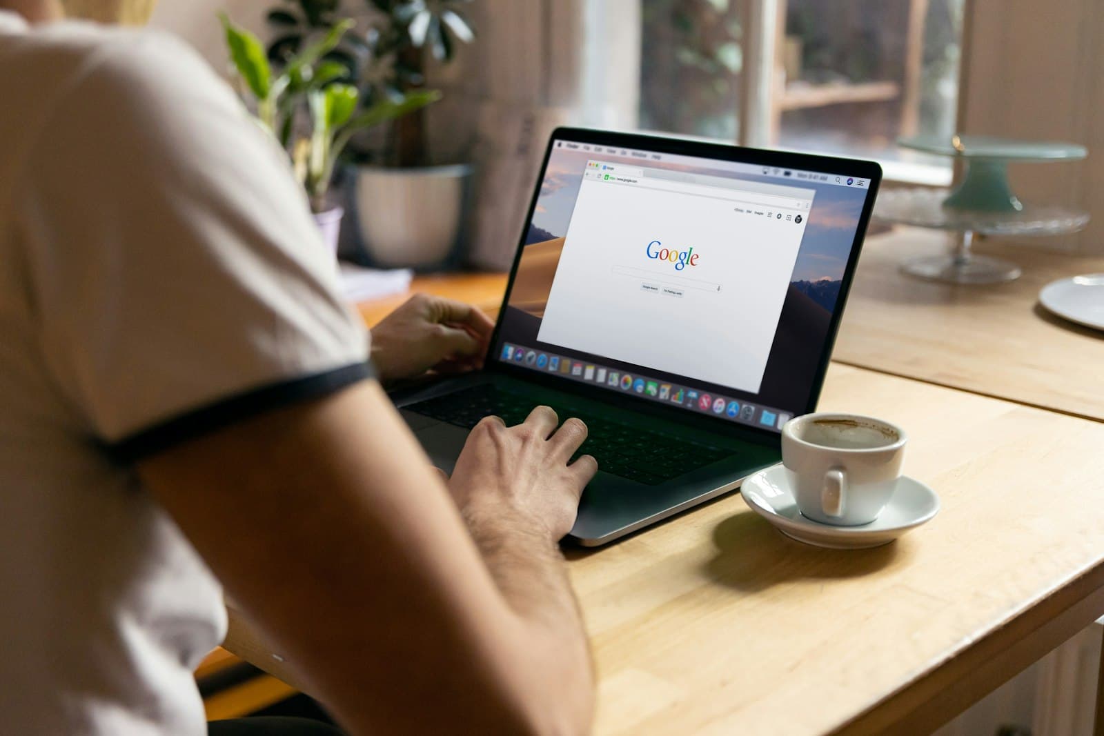Building an AI agent on a MacBook at a bright desk